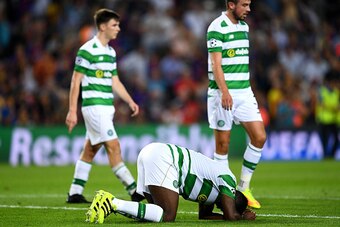 BARCELONA, SPAIN - SEPTEMBER 13:  Kolo Toure of Celtic reacts to an injury during the UEFA Champions League Group C match between FC Barcelona and Celtic FC at Camp Nou on September 13, 2016 in Barcelona, Spain.  (Photo by David Ramos/Getty Images)