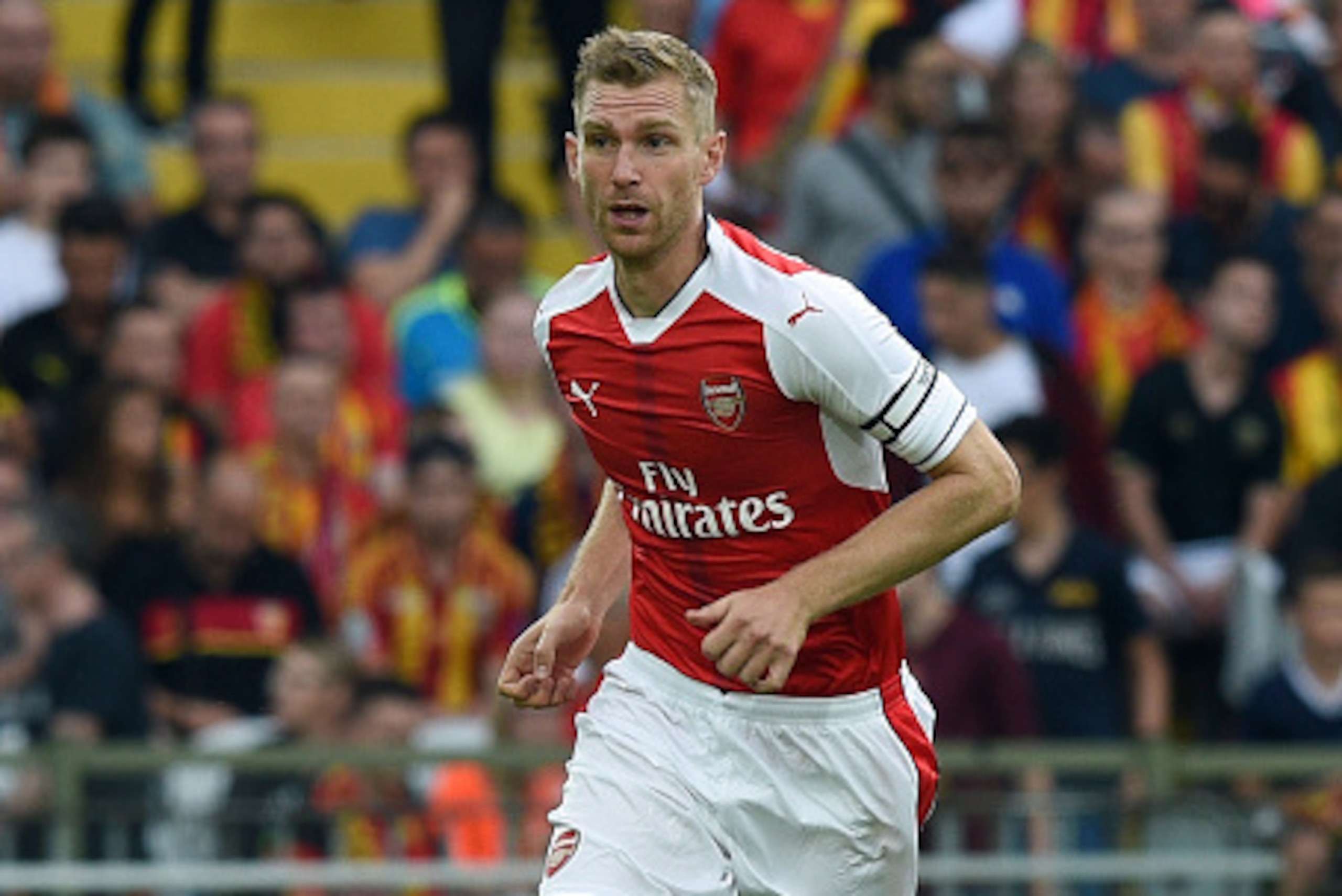 Arsenal's German defender Per Mertesacker controls the ball during the football match Lens versus Arsenal on July 22 2016, at the Felix Bollaert stadium in Lens. / AFP / DENIS CHARLET        (Photo credit should read DENIS CHARLET/AFP/Getty Images)