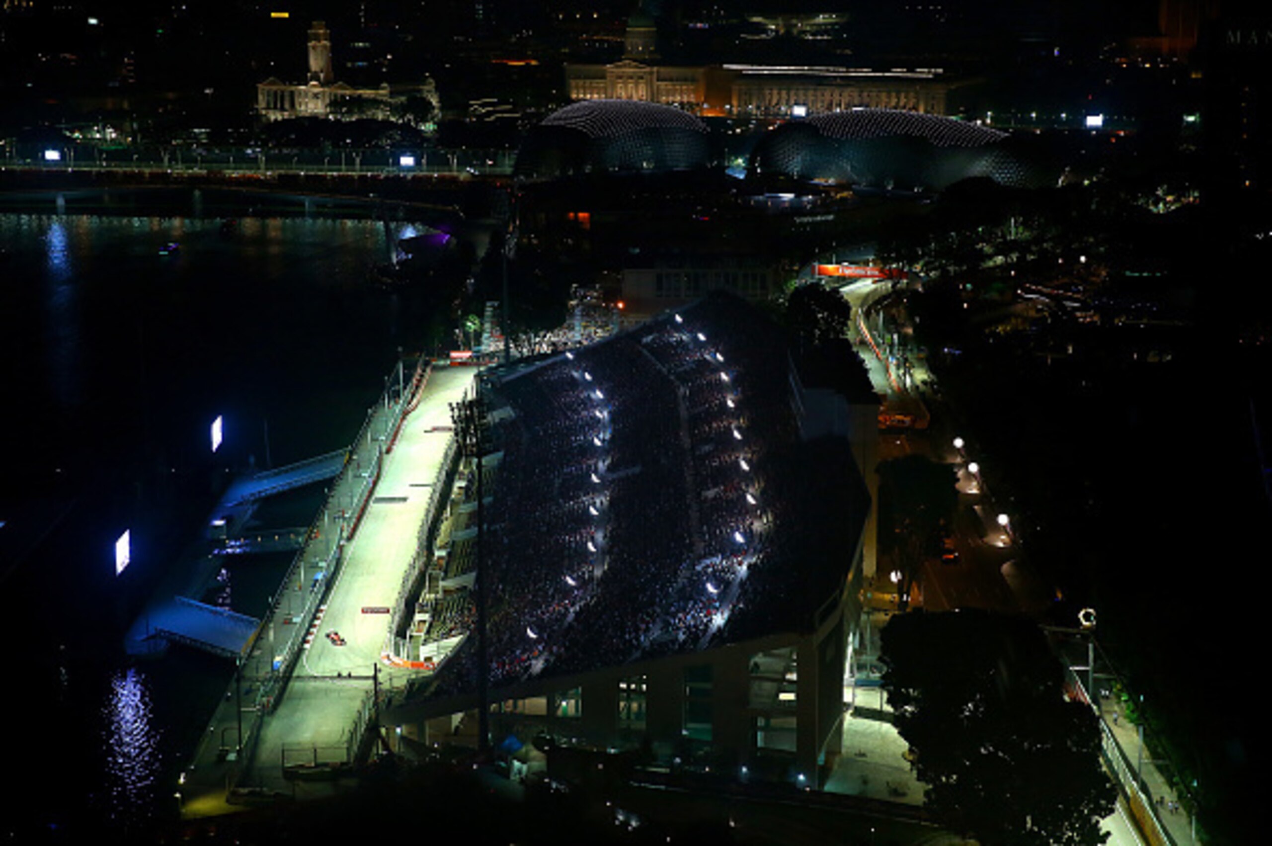 SINGAPORE - SEPTEMBER 20:  Sebastian Vettel of Germany and Ferrari drives during the Formula One Grand Prix of Singapore at Marina Bay Street Circuit on September 20, 2015 in Singapore.  (Photo by Dan Istitene/Getty Images)