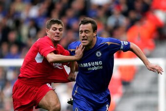 LIVERPOOL, UNITED KINGDOM - OCTOBER 02:  Steven Gerrard of Liverpool and John Terry of Chelsea battle for the ball during the Barclays Premiership match between Liverpool and Chelsea at Anfield on October 2, 2005 in Liverpool, England.  (Photo by Alex Liv