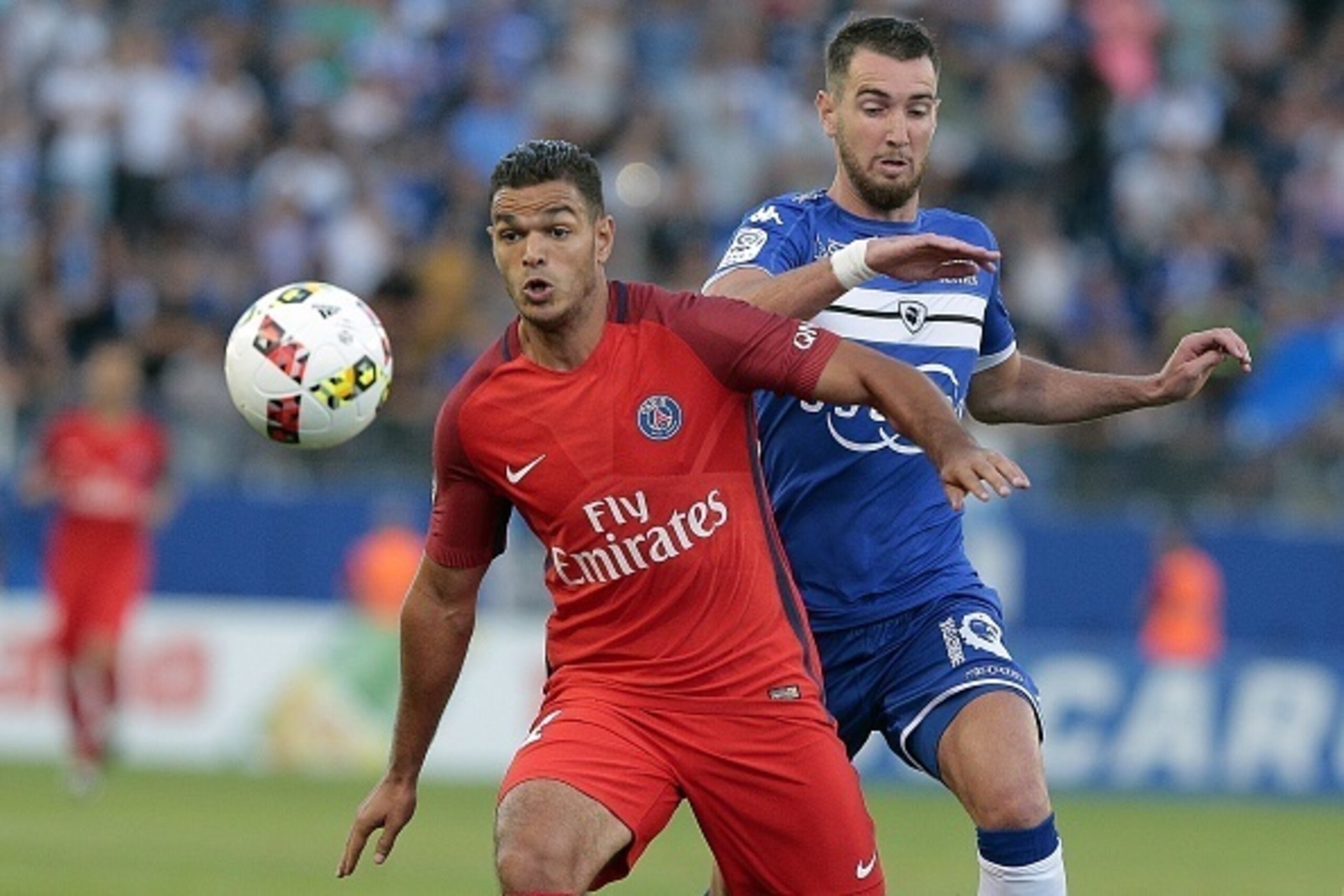 Paris Saint-Germain's French forward Hatem Ben Arfa (L) vies with Bastia's French defender Mathieu Peybernes during the French Ligue 1 football match between  Bastia (SCB) and Paris Saint Germain (PSG) on August 12, 2016 at the Armand Cesari stadium in Ba