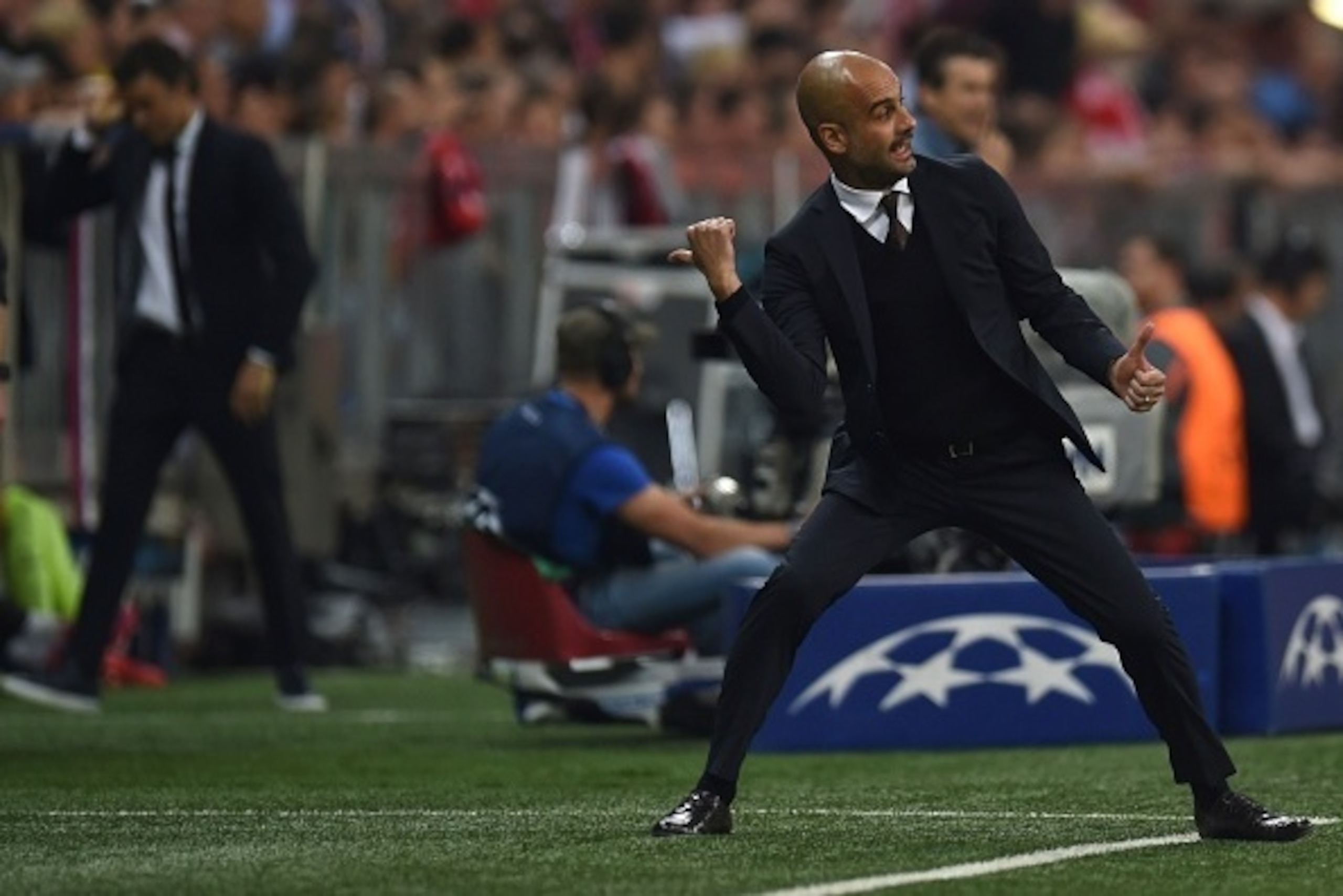 Bayern Munich's Spanish head coach Pep Guardiola reacts during the UEFA Champions League football match second leg semi final FC Bayern Munich vs FC Barcelona in Munich on May 12, 2015.  AFP PHOTO / PATRIK STOLLARZ        (Photo credit should read PATRIK 