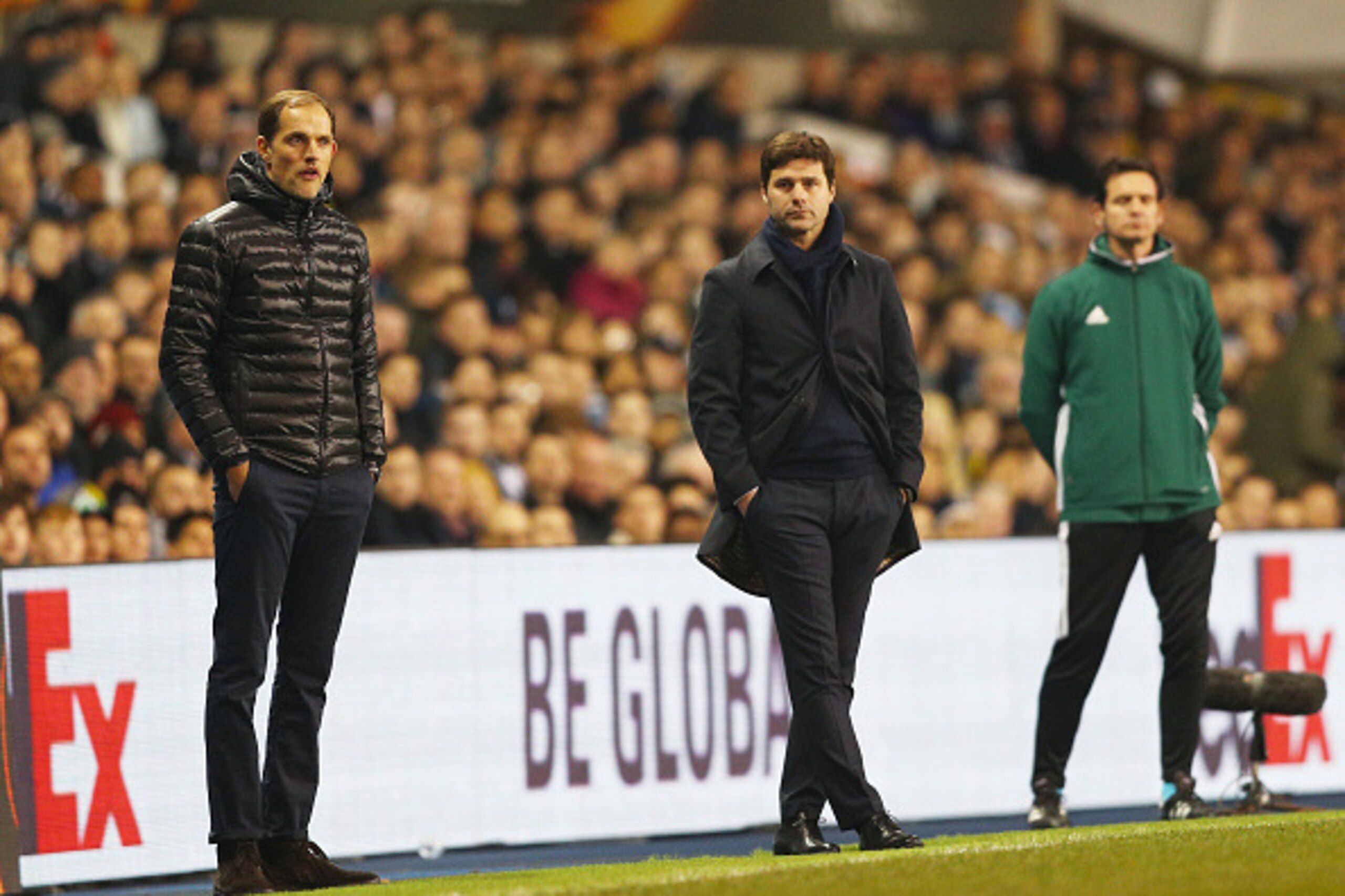 LONDON, ENGLAND - MARCH 17:  Thomas Tuchel manager of Borussia Dortmund and Mauricio Pochettino manager of Tottenham Hotspur look on during the UEFA Europa League round of 16, second leg match between Tottenham Hotspur and Borussia Dortmund at White Hart 