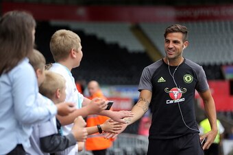 SWANSEA, WALES - SEPTEMBER 11: Cesc Fabregas of Chelsea is greeted by young supporters as he arrives prior to the Premier League match between Swansea City and Chelsea at The Liberty Stadium on September 11, 2016 in Swansea, Wales. (photo by Athena Pictur