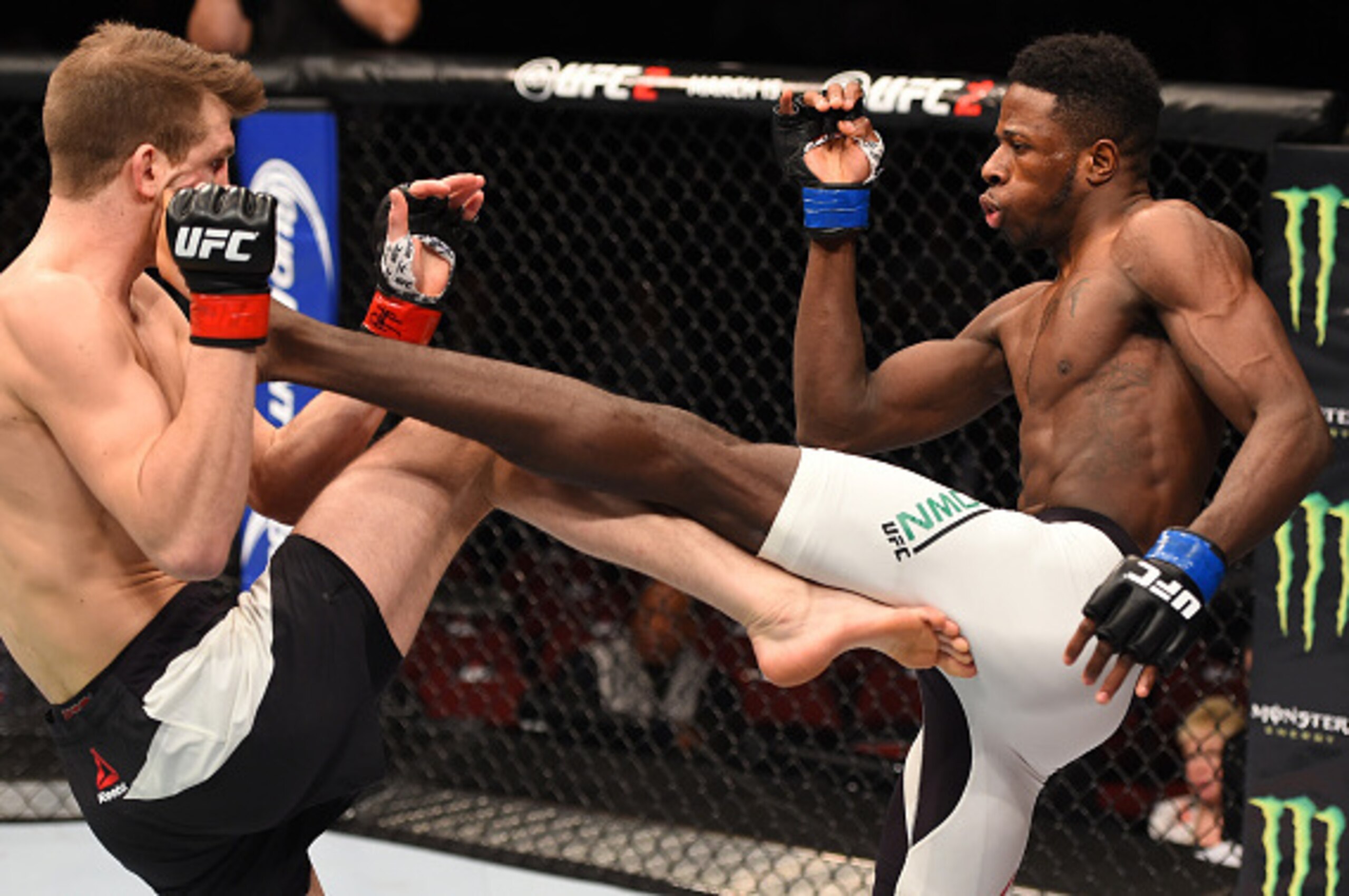 NEWARK, NJ - JANUARY 30:  (R-L) Randy Brown kicks Matt Dwyer in their welterweight bout during the UFC Fight Night event at the Prudential Center on January 30, 2016 in Newark, New Jersey. (Photo by Josh Hedges/Zuffa LLC/Zuffa LLC via Getty Images)