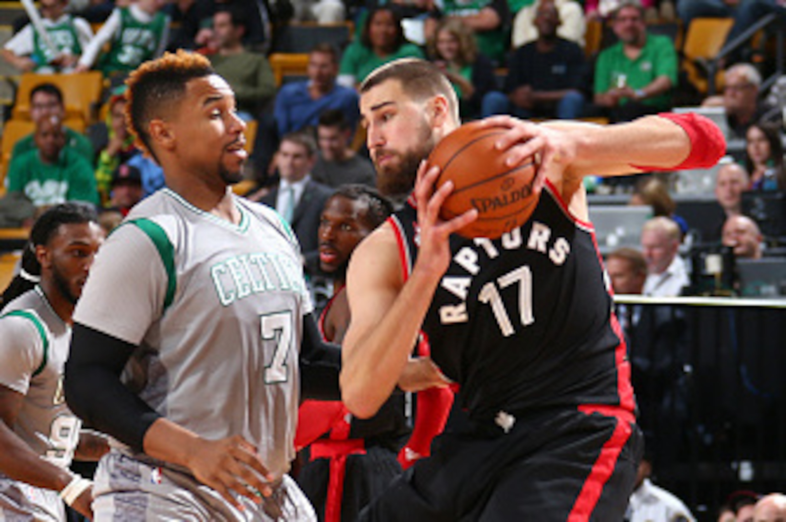 BOSTON, MA - OCTOBER 30: Jonas Valanciunas #17 of the Toronto Raptors is guarded by Jared Sullinger #7 of the Boston Celtics during a game on October 30, 2015 at TD Garden in Boston, Massachusetts. NOTE TO USER: User expressly acknowledges and agrees that