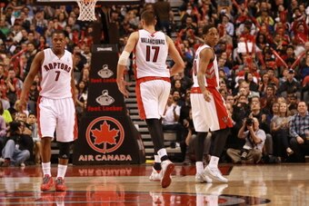 TORONTO,ON - APRIL 11:  Kyle Lowry #7, Jonas Valanciunas #17 and DeMar DeRozan #10 of the Toronto Raptors runs up court against the New York Knicks at the Air Canada Centre on April 11, 2014 in Toronto, Ontario, Canada. NOTE TO USER: User expressly acknow
