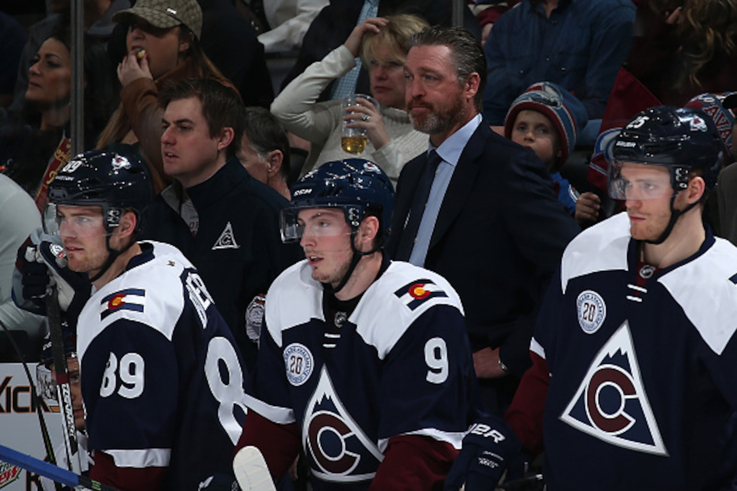 DENVER, CO - APRIL 03: Head coach Patrick Roy of the Colorado Avalanche looks on from the bench behind Mikkel Boedker #89, Matt Duchene #9 and Mikhail Grigorenko #25 of the Colorado Avalanche as they face the St. Louis Blues at Pepsi Center on April 3, 2 DENVER, CO - APRIL 03: Head coach Patrick Roy of the Colorado Avalanche looks on from the bench behind Mikkel Boedker #89, Matt Duchene #9 and Mikhail Grigorenko #25 of the Colorado Avalanche as they face the St. Louis Blues at Pepsi Center on April 3, 2