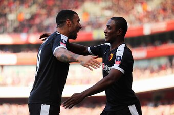 LONDON, ENGLAND - MARCH 13:  Odion Ighalo of Watford (R) celebrates with team mate Troy Deeney as he scores their first goal during the Emirates FA Cup sixth round match between Arsenal and Watford at Emirates Stadium on March 13, 2016 in London, England.