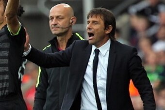 SWANSEA, WALES - SEPTEMBER 11: Cesar Azpilicueta of Chelsea (C) and manager of Chelsea and Antonio Conte (R) protest to the referee during the Premier League match between Swansea City and Chelsea at The Liberty Stadium on September 11, 2016 in Swansea, W