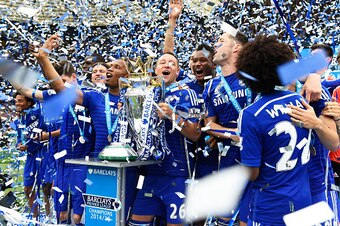 LONDON, ENGLAND - MAY 24:  John Terry of Chelsea celebrates lifts the trophy alongside team mates after the Barclays Premier League match between Chelsea and Sunderland at Stamford Bridge on May 24, 2015 in London, England. Chelsea were crowned Premier Le