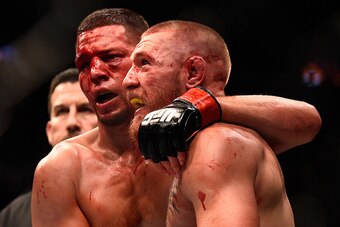 LAS VEGAS, NV - AUGUST 20:  (L-R) Nate Diaz and Conor McGregor of Ireland embrace after finishing five rounds in their welterweight bout during the UFC 202 event at T-Mobile Arena on August 20, 2016 in Las Vegas, Nevada. (Photo by Jeff Bottari/Zuffa LLC/Z