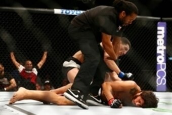 March 5, 2016; Las Vegas, NV, USA; Nordine Taleb lands punches against Erick Silva as referee Herb Dean separates them during UFC 196 at MGM Grand Garden Arena. Mandatory Credit: Mark J. Rebilas-USA TODAY Sports