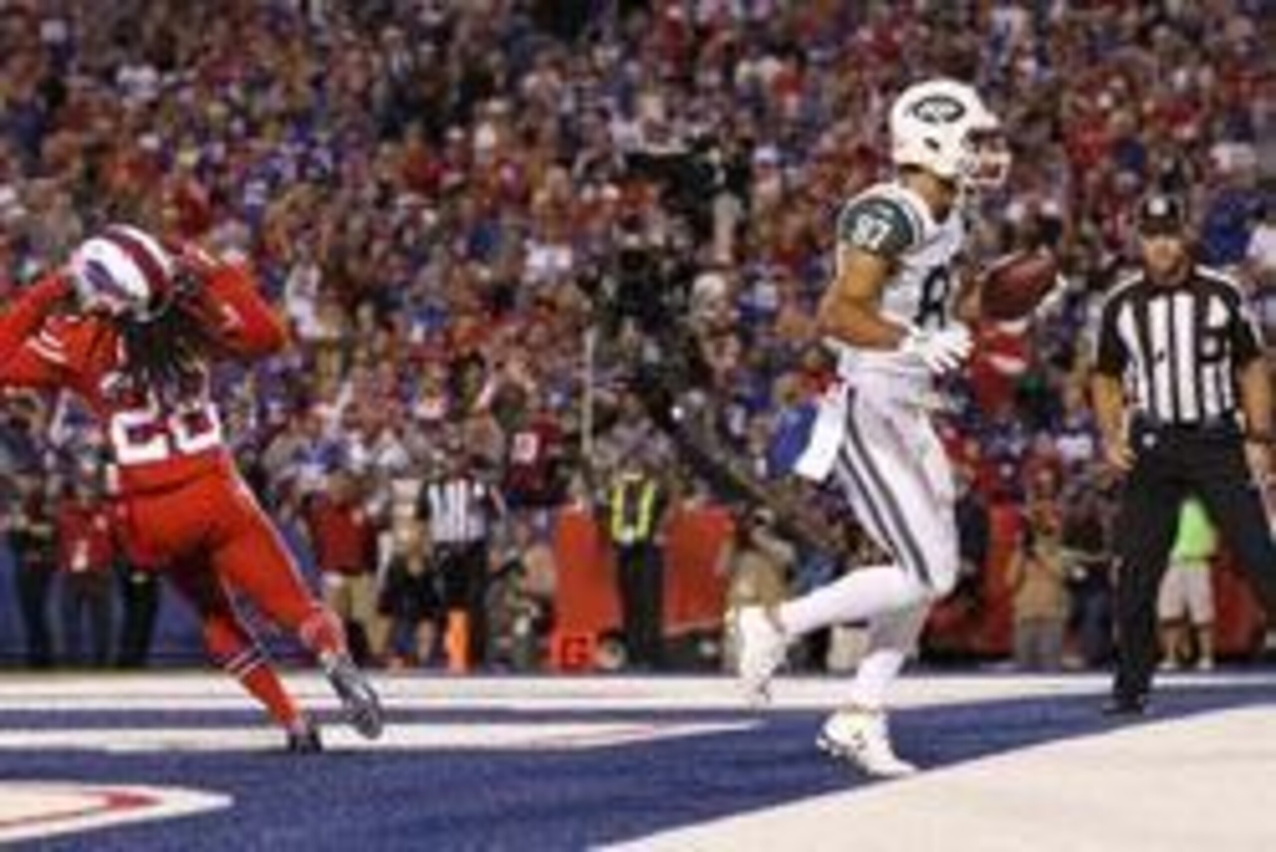 Sep 15, 2016; Orchard Park, NY, USA; New York Jets wide receiver Eric Decker (87) scores a touchdown as Buffalo Bills cornerback Ronald Darby (28) reacts during the first half at New Era Field. Mandatory Credit: Kevin Hoffman-USA TODAY Sports