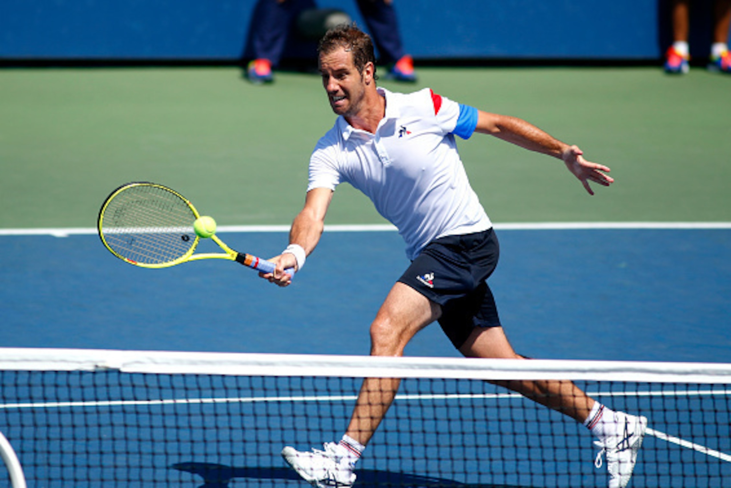 Richard Gasquet of France serves to Kyle Edmund of Britain during their 2016 US Open Men's Singles Round 1 match at the USTA Billie Jean King National Tennis Center on August 29, 2016 in New York. / AFP / KENA BETANCUR        (Photo credit should read KEN