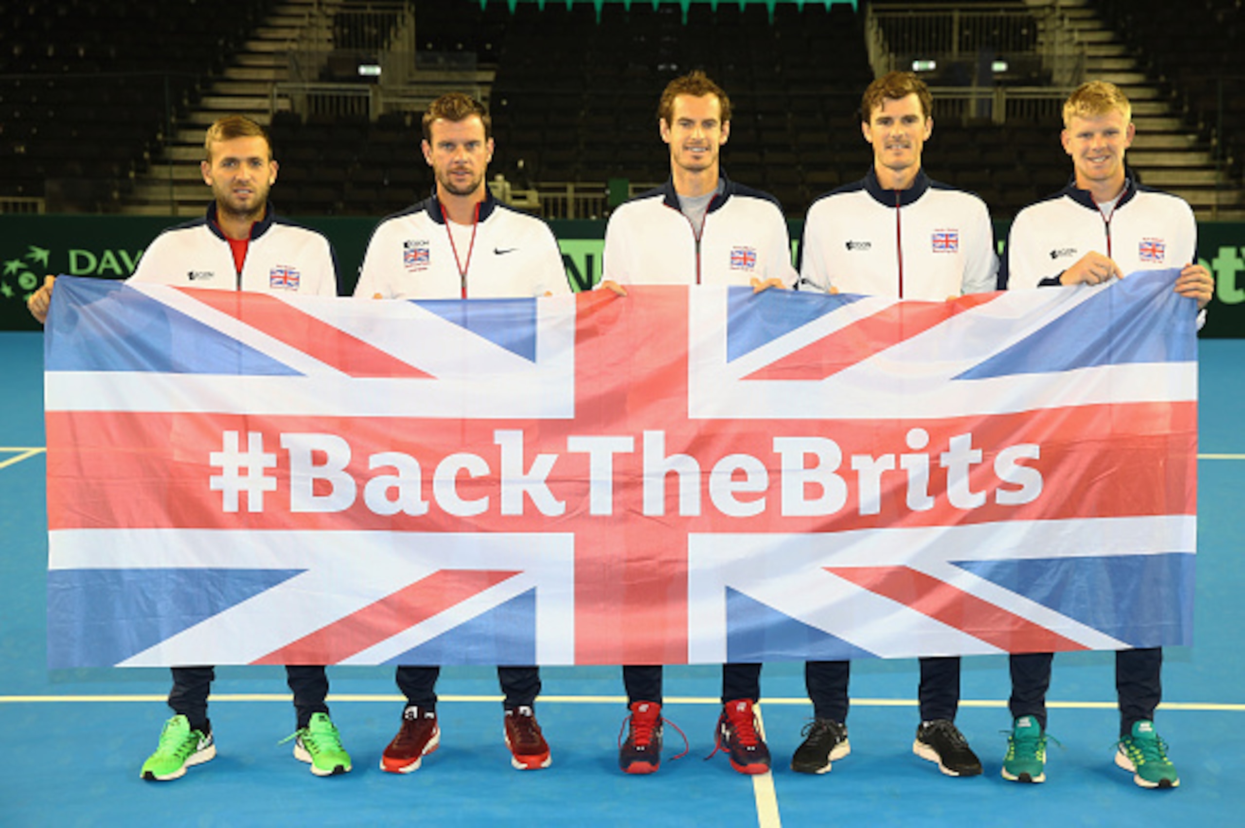 GLASGOW, SCOTLAND - SEPTEMBER 15:  The Great Britain team  L-R  Dan Evans,team captain Leon Smith,Andy MurrayJamie Murray,Kyle Edmund pose for a team photograph with the Union Jack after the draw ceremony prior to the Davis Cup World Group semi final tie 