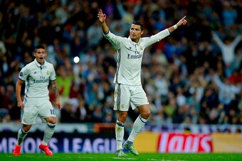 MADRID, SPAIN - SEPTEMBER 14: Cristiano Ronaldo of Real Madrid CF celebrates scoring their opening goal during the UEFA Champions League group stage match between Real Madrid CF and Sporting Clube de Portugal at Santiago Bernabeu stadium  on September 14,