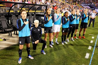 COLUMBUS, OH - SEPTEMBER 15:  Megan Rapinoe #15 of the U.S. Women's National Team kneels during the playing of the U.S. National Anthem before a match against Thailand on September 15, 2016 at MAPFRE Stadium in Columbus, Ohio.  (Photo by Jamie Sabau/Getty