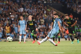 Manchester City's Argentinian striker Sergio Aguero scores their second goal from a penalty during the UEFA Champions League group C football match between Manchester City and Borussia Monchengladbach at the Etihad stadium in Manchester, northwest England