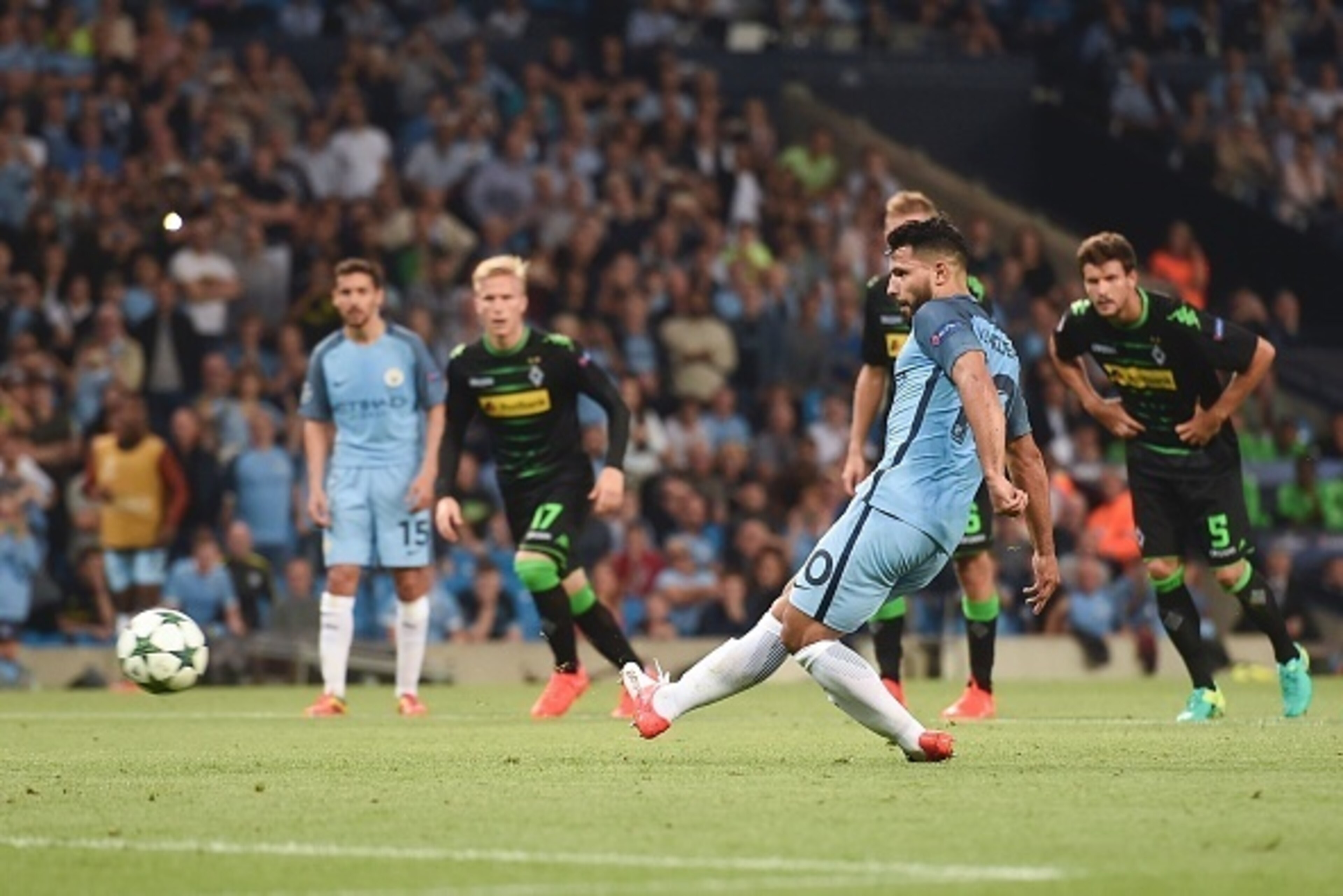 Manchester City's Argentinian striker Sergio Aguero scores their second goal from a penalty during the UEFA Champions League group C football match between Manchester City and Borussia Monchengladbach at the Etihad stadium in Manchester, northwest England