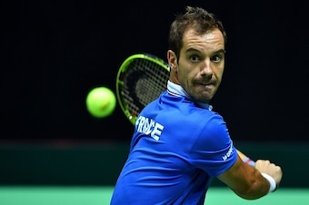 France's Richard Gasquet returns the ball against Croatia's Borna Coric during the Davis Cup World Group semifinal single match between Croatia and France at 'Kresimir Cosic' hall in Zadar, on September 16, 2016.   / AFP / ANDREJ ISAKOVIC        (Photo cr