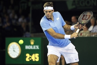 Argentina's Juan Martin del Potro returns to Britain's Andy Murray during the Davis Cup World Group semifinal singles match between England and Argentina at the Emirates Arena in Glasgow, west Scotland, on September 16, 2016. 
Argentina's Juan Martin del 