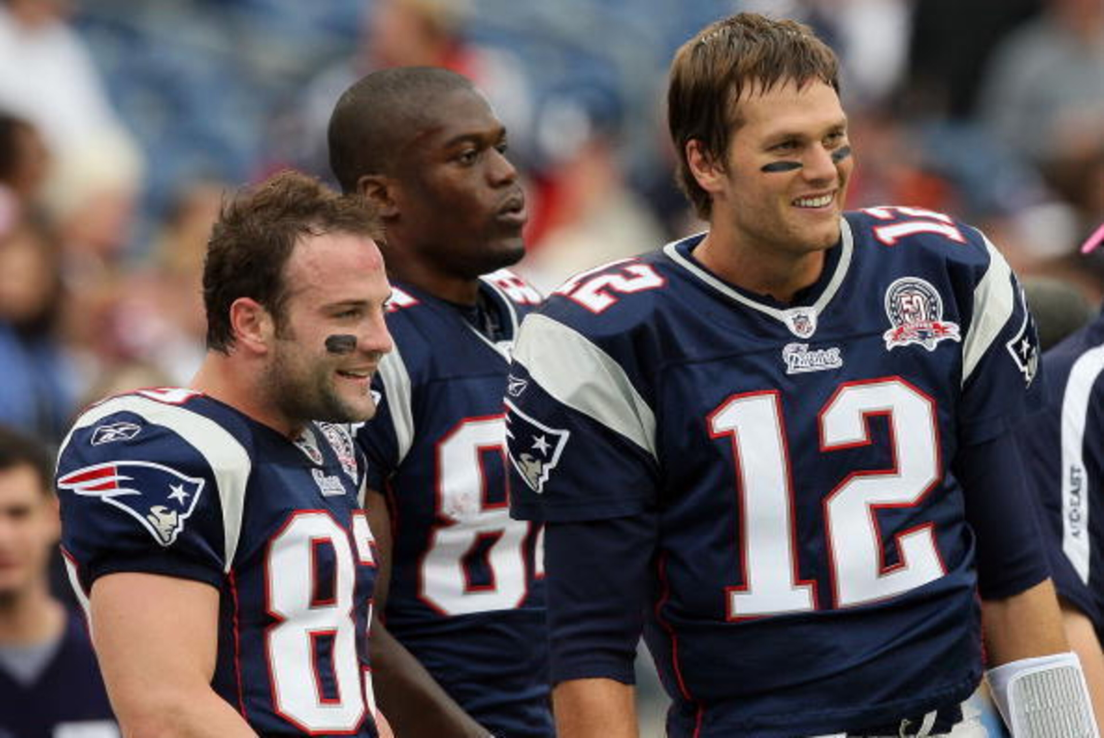 FOXBORO, MA - OCTOBER 4:  (L-R) Wes Welker #83, Benjamin Watson #84, and Tom Brady #12 of the New England Patriots, stand on the sideline before a game with the Baltimore Ravens at Gillette Stadium on October 4, 2009 in Foxboro, Massachusetts. (Photo by J
