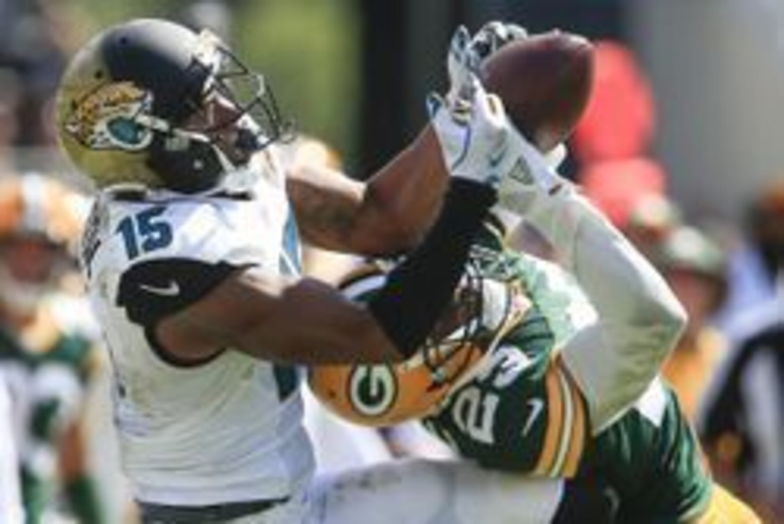 Sep 11, 2016; Jacksonville, FL, USA;  Jacksonville Jaguars wide receiver Allen Robinson (15) has the ball deflected by Green Bay Packers cornerback Damarious Randall (23) during the second  half of a football game at EverBank Field.The Green Bay Packers w