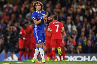 LONDON, ENGLAND - SEPTEMBER 16:  David Luiz of Chelsea reacts as Liverpool players celebrate as Dejan Lovren scores their first goal during the Premier League match between Chelsea and Liverpool at Stamford Bridge on September 16, 2016 in London, England.