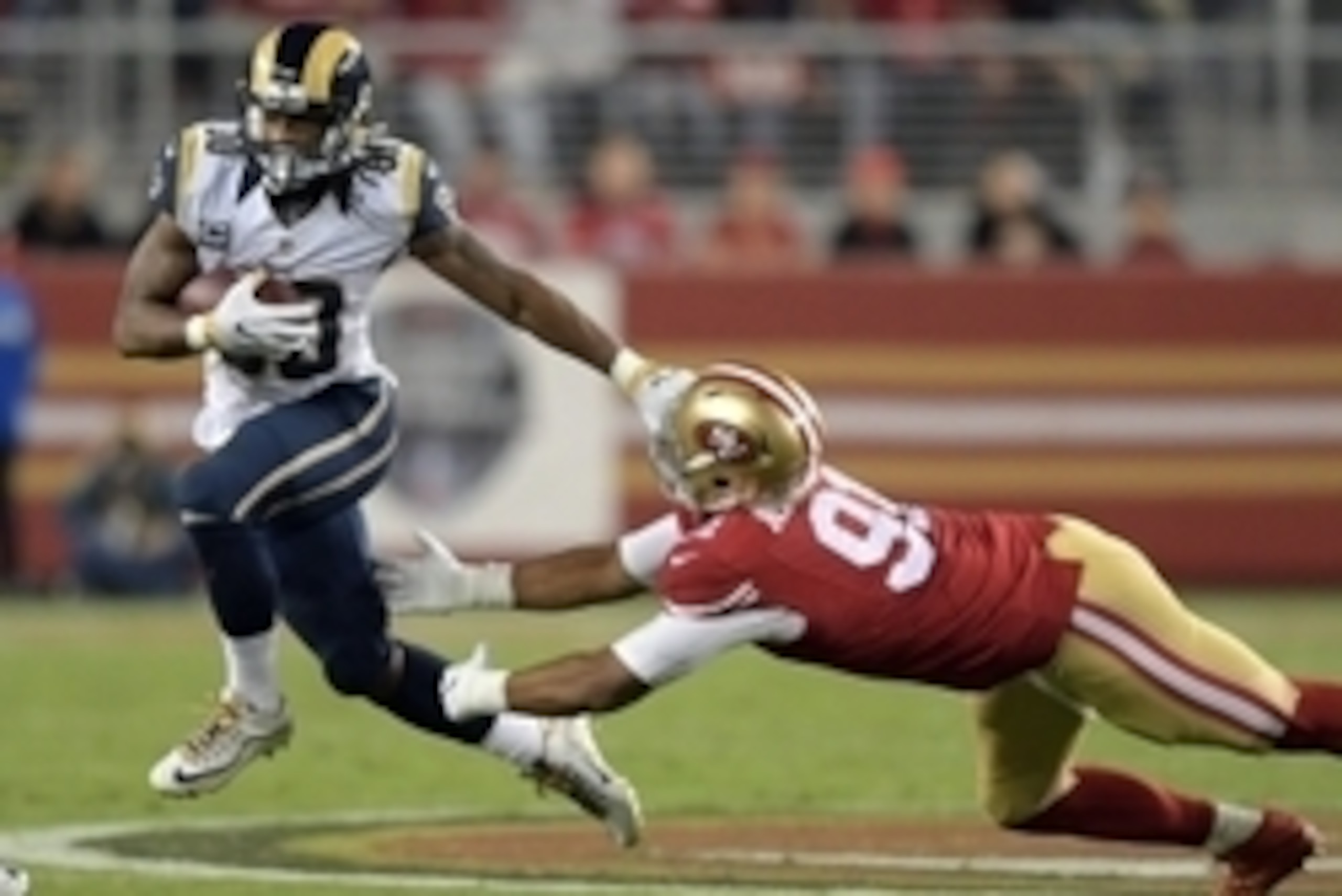 Sep 12, 2016; Santa Clara, CA, USA; Los Angeles Rams running back Todd Gurley (30) is defended by San Francisco 49ers defensive end Arik Armstead (91) during a NFL game at Levi's Stadium. Mandatory Credit: Kirby Lee-USA TODAY Sports
