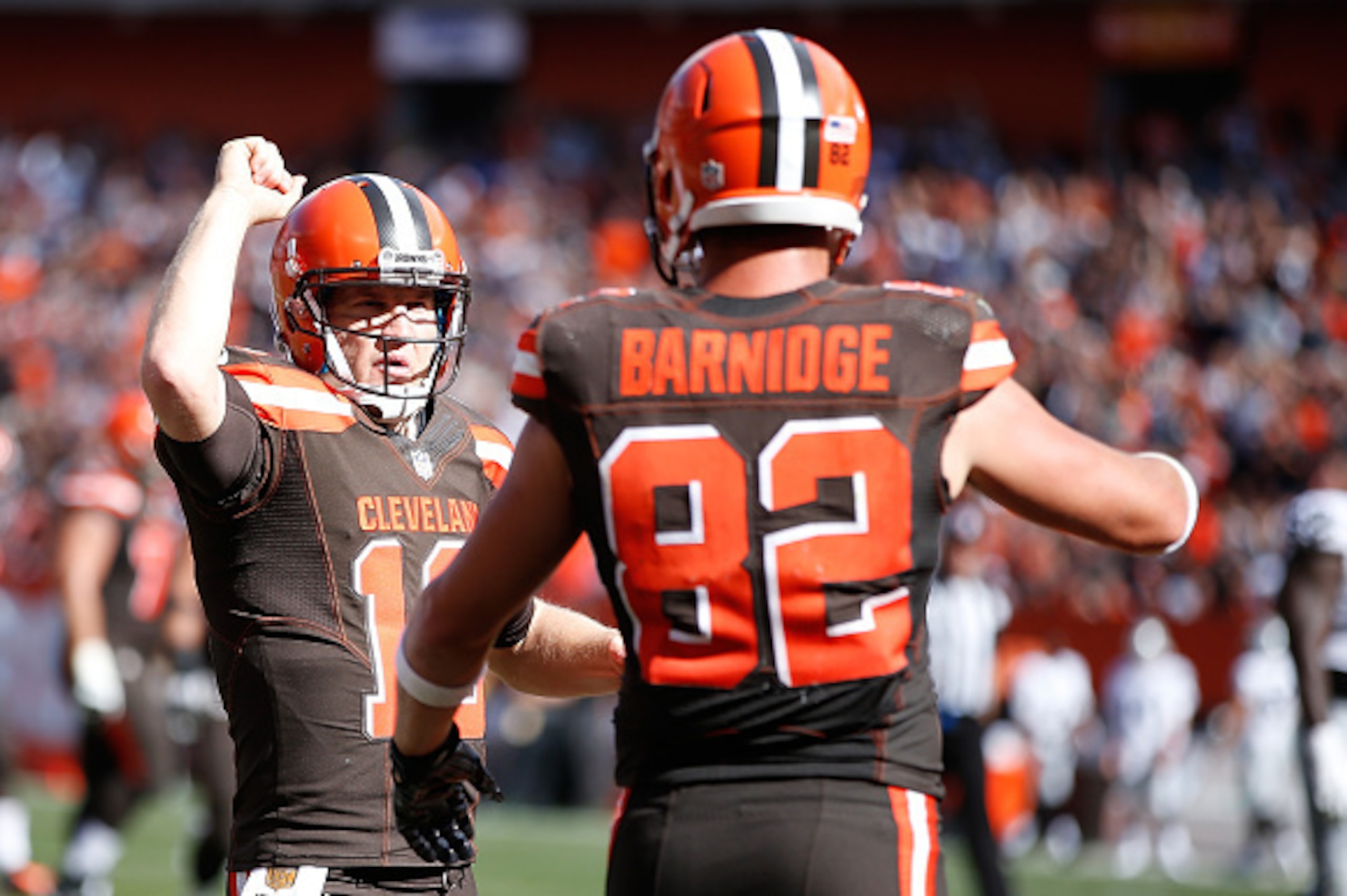 CLEVELAND, OH - SEPTEMBER 27:  Gary Barnidge #82 of the Cleveland Browns celebrates his touchdown with Josh McCown #13 during the third quarter against the Oakland Raiders at FirstEnergy Stadium on September 27, 2015 in Cleveland, Ohio.  (Photo by Joe Rob