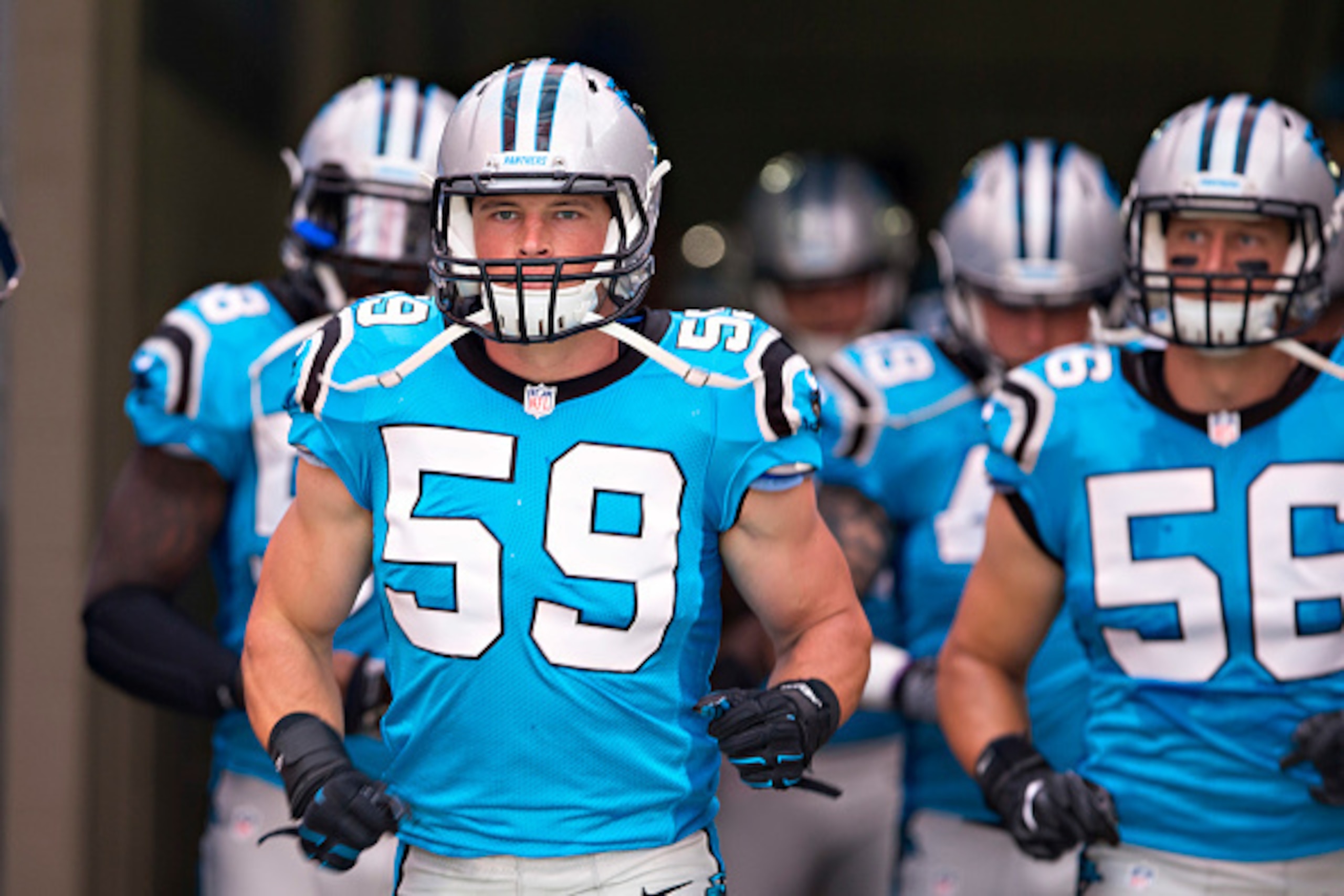 NASHVILLE, TN - AUGUST 20:  Luke Kuechly #59 of the Carolina Panthers runs out of the tunnel onto the field before a preseason game against the Tennessee Titans at Nissan Stadium on August 20, 2016 in Nashville, Tennessee.  The Panthers defeated the Titan