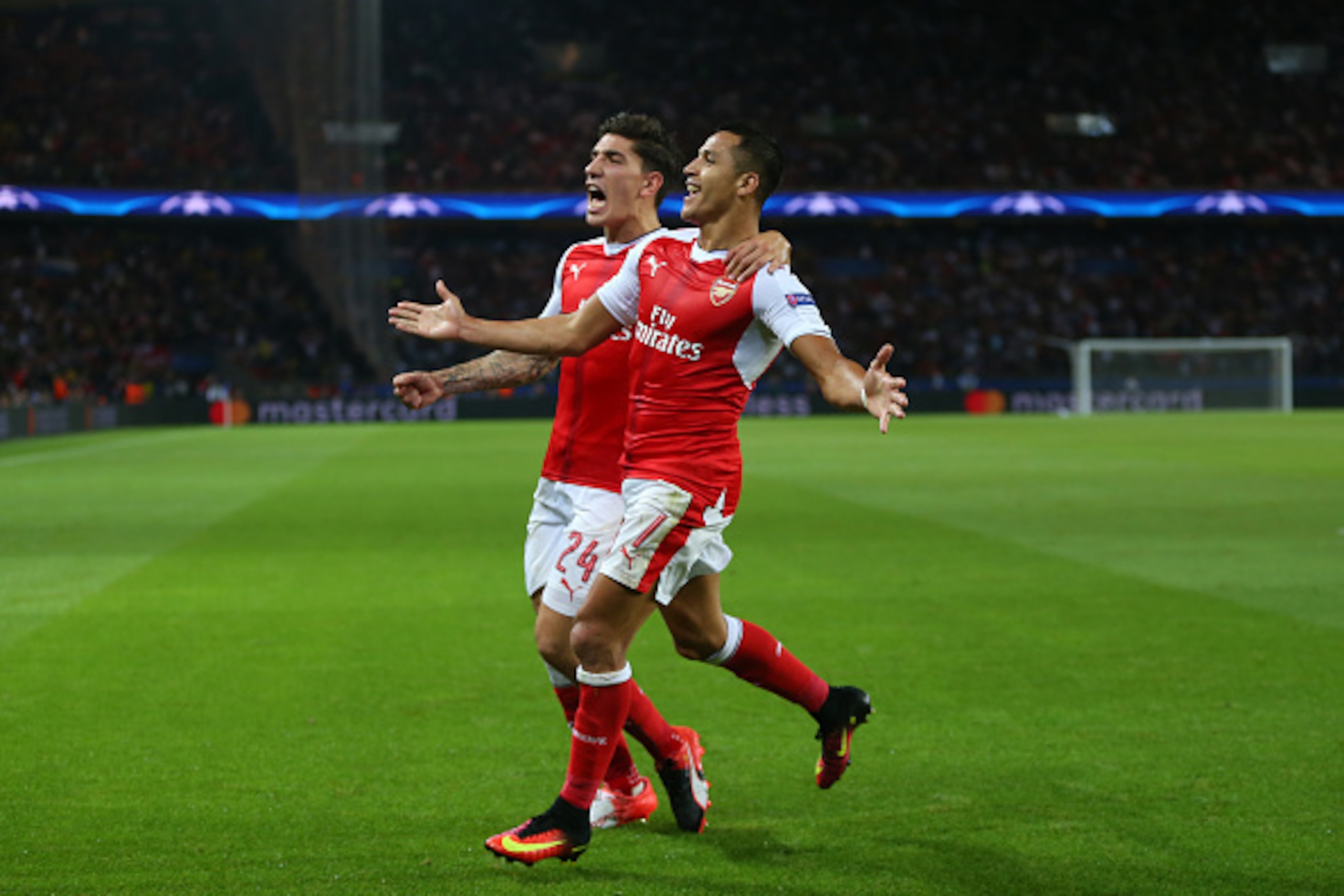 PARIS, FRANCE - SEPTEMBER 13: Alexis Sanchez of Arsenal celebrates after he scores to make it 1-1 with Hector Bellerin of Arsenal during the UEFA Champions League match between Paris Saint-Germain and Arsenal at Parc des Princes on September 13, 2016 in P PARIS, FRANCE - SEPTEMBER 13: Alexis Sanchez of Arsenal celebrates after he scores to make it 1-1 with Hector Bellerin of Arsenal during the UEFA Champions League match between Paris Saint-Germain and Arsenal at Parc des Princes on September 13, 2016 in P
