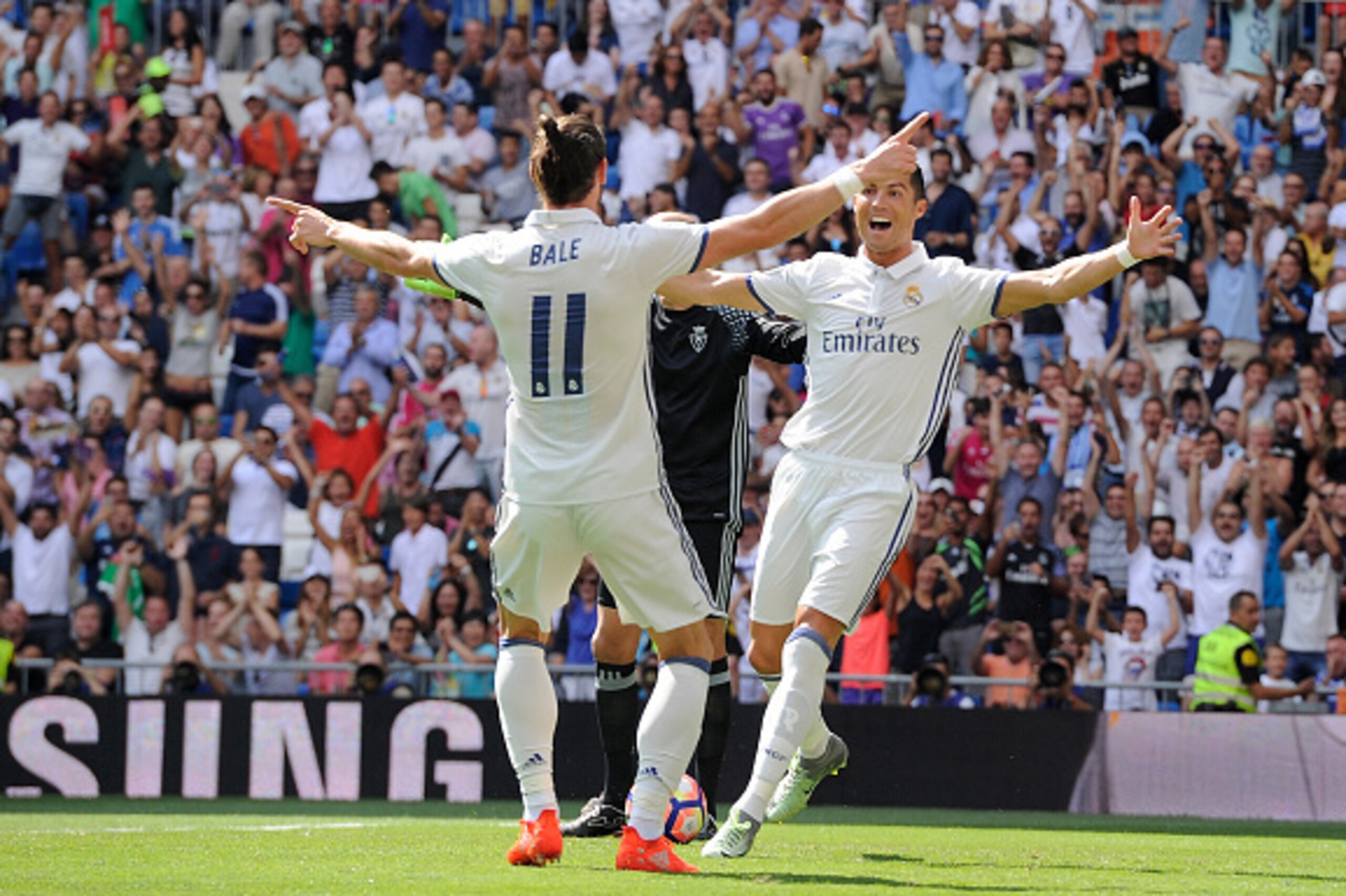 MADRID, SPAIN - SEPTEMBER 10:  Cristiano Ronaldo of Real Madrid celebrates with Gareth Bale after scoring opening goal during the La Liga match between Real Madrid CF and CA Osasuna at Estadio Santiago Bernabeu on September 10, 2016 in Madrid, Spain.  (Ph