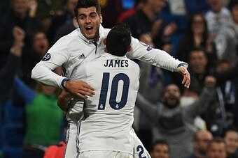 Real Madrid's forward Alvaro Morata (back) is congratulated by Real Madrid's Colombian midfielder James Rodriguez after scoring during the UEFA Champions League football match Real Madrid CF vs Sporting CP at the Santiago Bernabeu stadium in Madrid on Sep