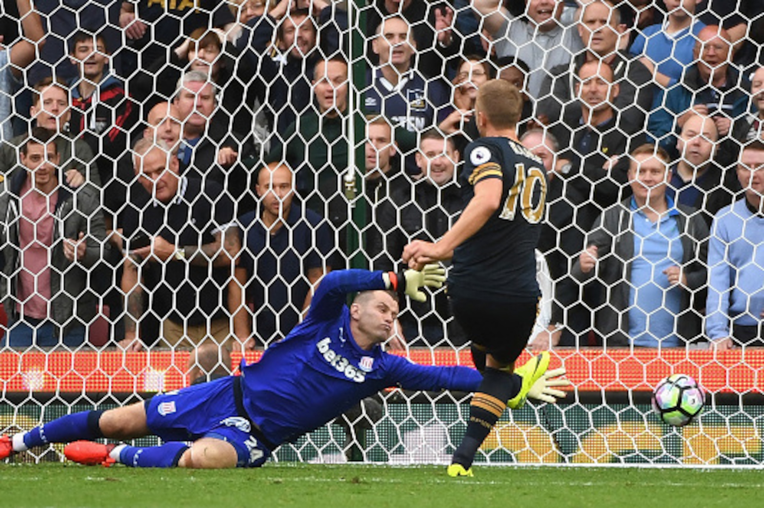 STOKE ON TRENT, ENGLAND - SEPTEMBER 10: Harry Kane of Tottenham Hotspur scores his sides first goal past Shay Given of Stoke City  during the Premier League match between Stoke City and Tottenham Hotspur at Britannia Stadium on September 10, 2016 in Stoke