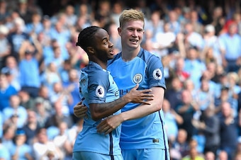 MANCHESTER, ENGLAND - SEPTEMBER 17:  Raheem Sterling of Manchester City (L) celebrates scoring his sides third goal with Kevin De Bruyne of Manchester City (R) during the Premier League match between Manchester City and AFC Bournemouth at the Etihad Stadi