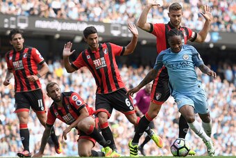 MANCHESTER, ENGLAND - SEPTEMBER 17:  Raheem Sterling of Manchester City burst through the AFC Bournemouth defence during the Premier League match between Manchester City and AFC Bournemouth at the Etihad Stadium on September 17, 2016 in Manchester, Englan