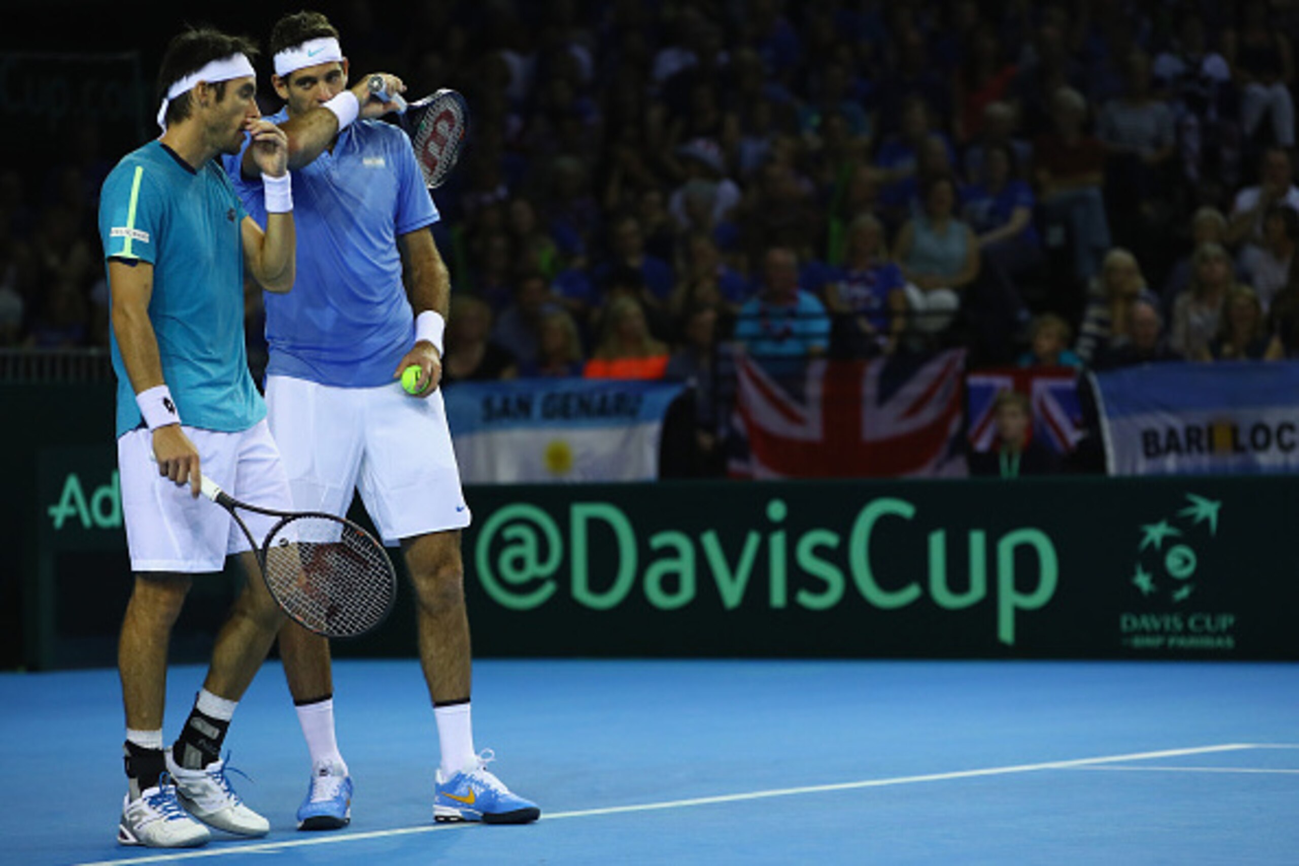 GLASGOW, SCOTLAND - SEPTEMBER 17: Juan Martin Del Potro and Leonardo Mayer of Argentina discuss tatics against  Andy Murray and Jamie Murray of Great Britain in their doubles match during the Davis Cup World Group semi final tie between Great Britain and 