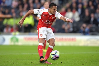 HULL, ENGLAND - SEPTEMBER 17:  Alexis Sanchez of Arsenal scores his sides third goal  during the Premier League match between Hull City and Arsenal at KCOM Stadium on September 17, 2016 in Hull, England.  (Photo by Tony Marshall/Getty Images)