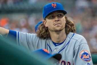 DETROIT, MI - AUGUST 05: Jacob deGrom #48 of the New York Mets look into the crowd in the second inning during a MLB game against the Detroit Tigers at Comerica Park on August 5, 2016 in Detroit, Michigan. The Tigers defeated the Mets 4-3. (Photo by Dave 
