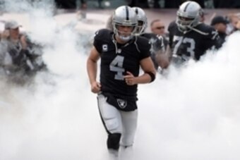 Dec 6, 2015; Oakland, CA, USA; Oakland Raiders quarterback Derek Carr (4) runs onto the field before an NFL football game against the Kansas City Chiefs at O.co Coliseum. The Chiefs defeated the Raiders 34-20. Mandatory Credit: Kirby Lee-USA TODAY Sports
