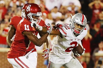 NORMAN, OK - SEPTEMBER 17:  Dede Westbrook #11 of the Oklahoma Sooners tackles Marshon Lattimore #2 of the Ohio State Buckeyes as he ran an interception back in the first half of their game at Gaylord Family Oklahoma Memorial Stadium on September 17, 2016