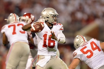 NORMAN, OK - SEPTEMBER 17: Quarterback J.T. Barrett #16 of the Ohio State Buckeyes throws a pass during the first half of their game against the Oklahoma Sooners on September 17, 2016 at Gaylord Family Oklahoma Memorial Stadium in Norman, Oklahoma. (Photo