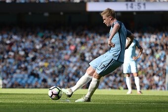 Manchester City's Belgian midfielder Kevin De Bruyne takes a free kick to score the opening goal during the English Premier League football match between Manchester City and Bournemouth at the Etihad Stadium in Manchester, north west England, on September