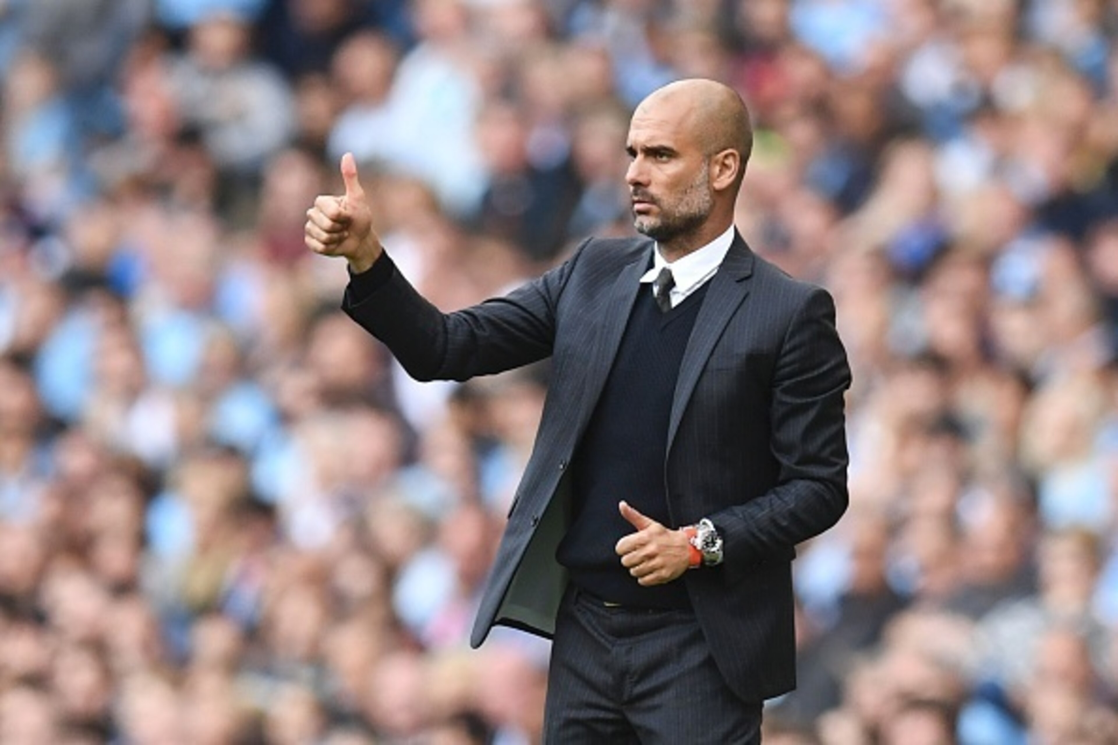 Manchester City's Spanish manager Pep Guardiola gives a thumbs up from the touchline during the English Premier League football match between Manchester City and Bournemouth at the Etihad Stadium in Manchester, north west England, on September 17, 2016. /