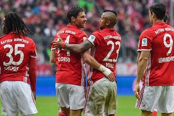 Bayern Munich's Spanish midfielder Xabi Alonso (2nd L) celebrates with his teammate Bayern Munich's Chilean midfielder Arturo Vidal (C-R) after scoring during the German first division Bundesliga football match of Bayern Munich vs FC Ingolstadt in Munich,