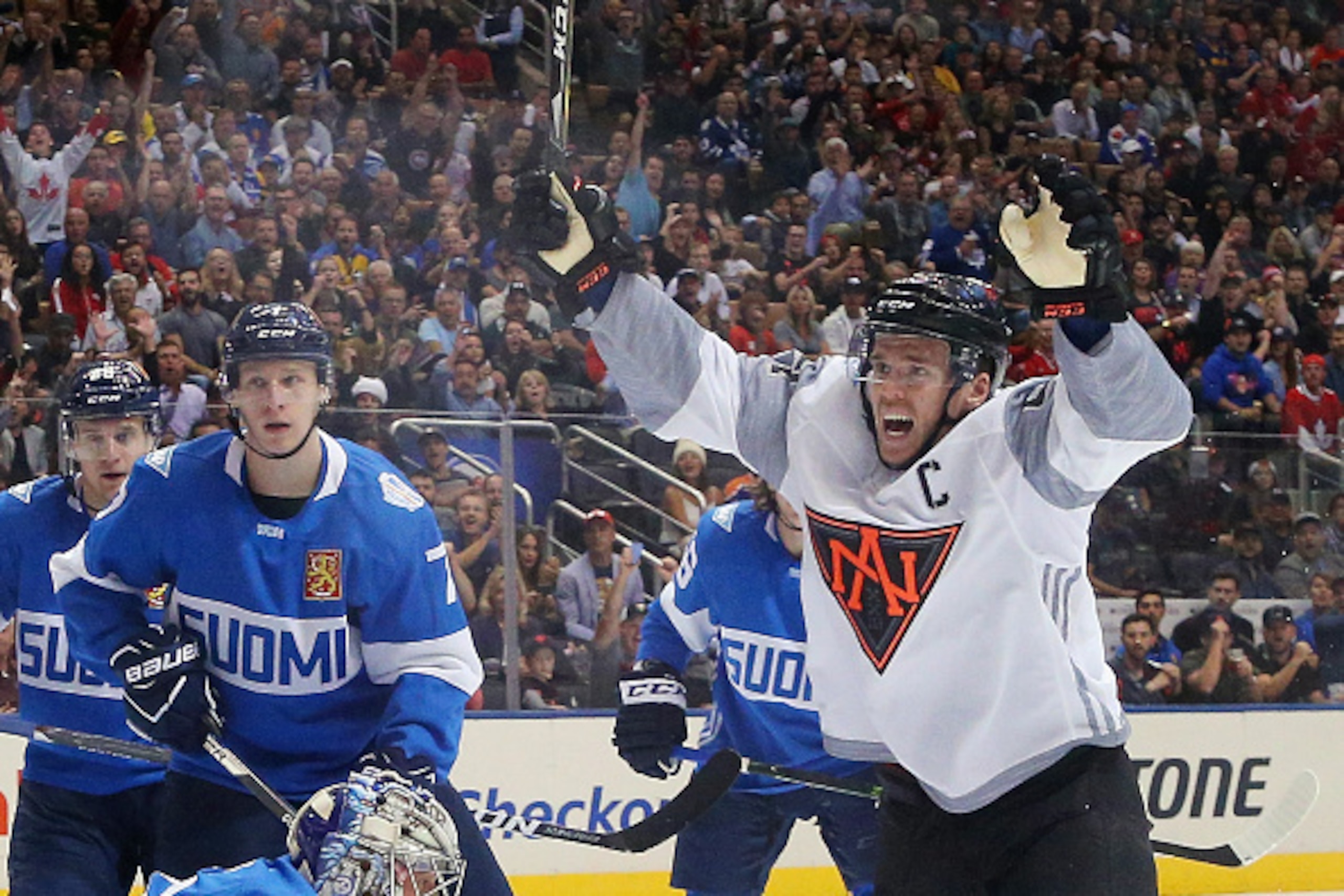 TORONTO, ON - SEPTEMBER 18:  Connor McDavid #97 of Team North America celebrates a first period goal by Jack Eichel #15 against Team Finland during the World Cup of Hockey tournament at the Air Canada Centre on September 18, 2016 in Toronto, Canada.  (Pho