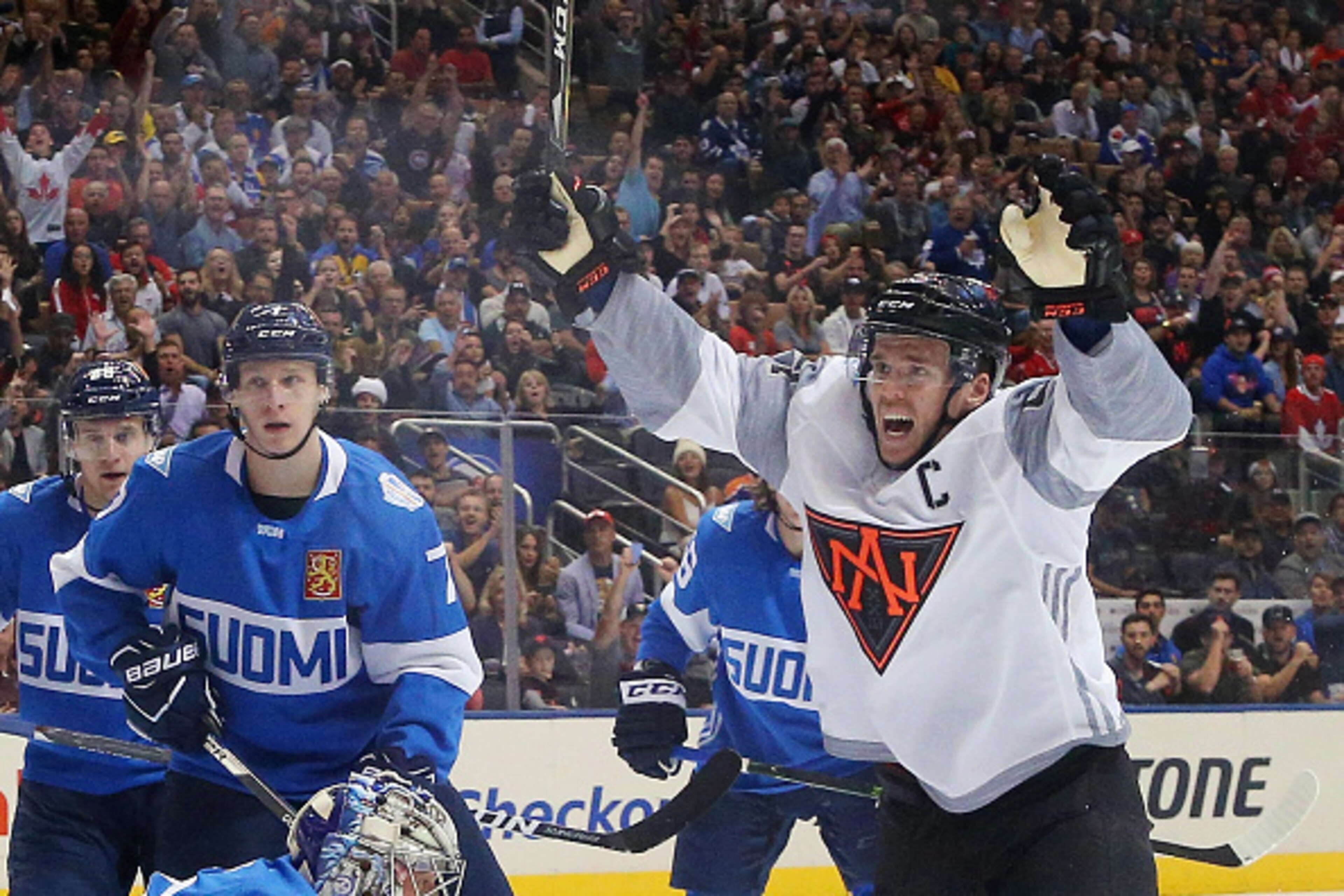 TORONTO, ON - SEPTEMBER 18:  Connor McDavid #97 of Team North America celebrates a first period goal by Jack Eichel #15 against Team Finland during the World Cup of Hockey tournament at the Air Canada Centre on September 18, 2016 in Toronto, Canada.  (Pho