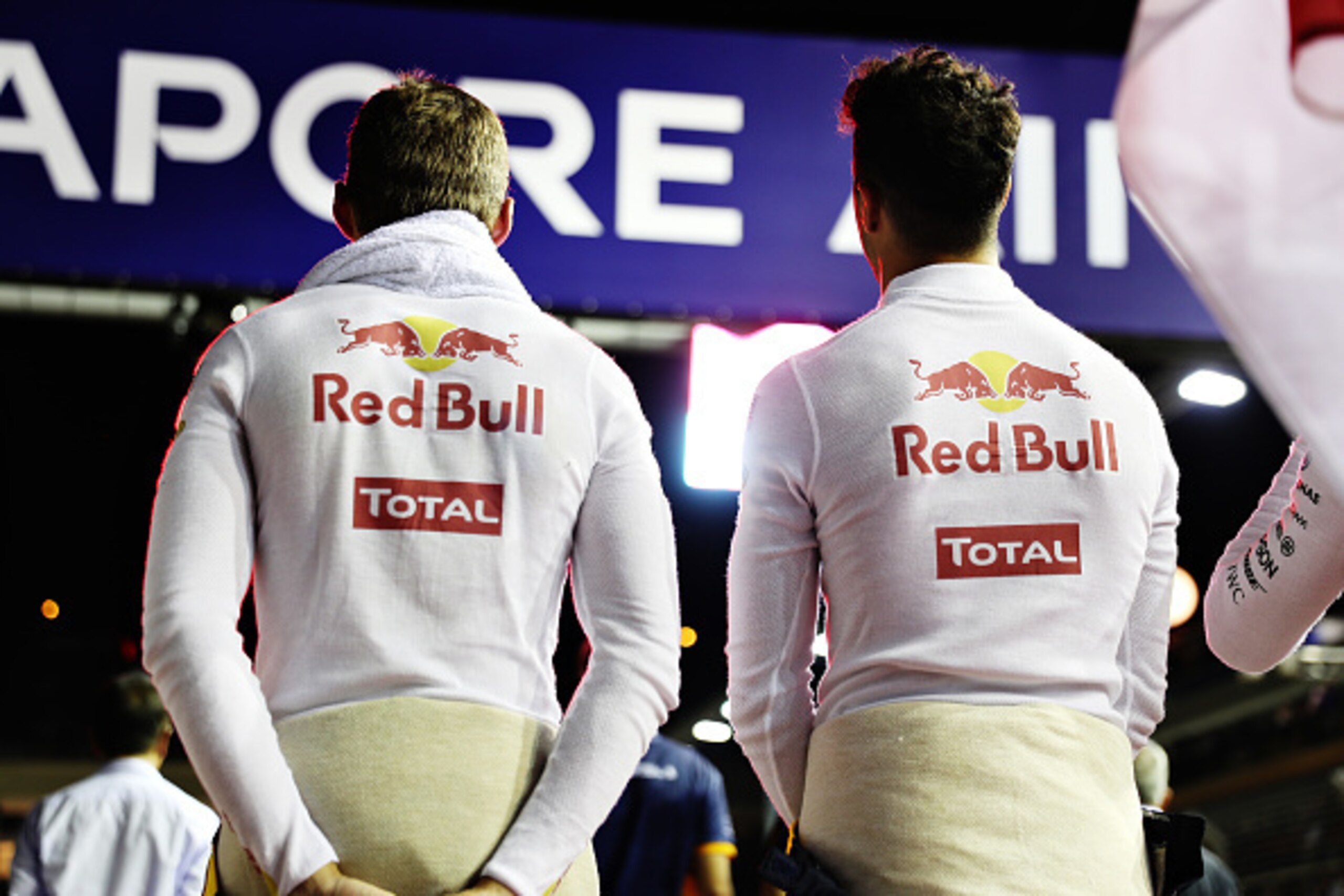 SINGAPORE - SEPTEMBER 18: Max Verstappen of Netherlands and Red Bull Racing and Daniel Ricciardo of Australia and Red Bull Racing on the grid during the Formula One Grand Prix of Singapore at Marina Bay Street Circuit on September 18, 2016 in Singapore.  